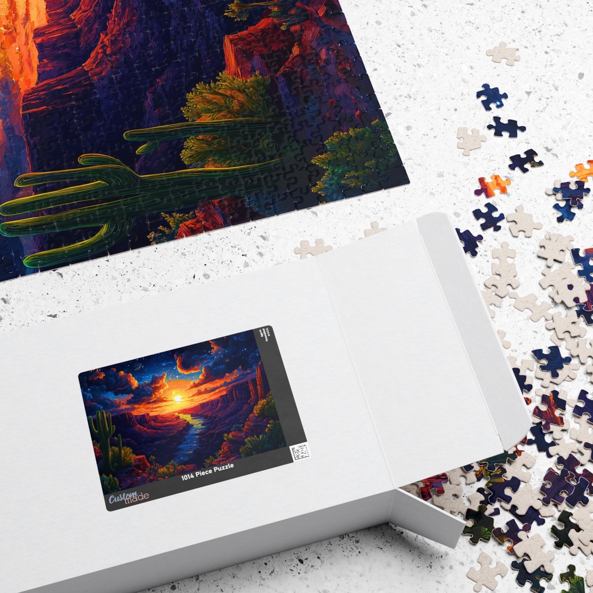 Arizona Sunset 1014 Piece Art Puzzle by Printify, showcasing vibrant desert landscape with a glowing sunset and scattered puzzle pieces.