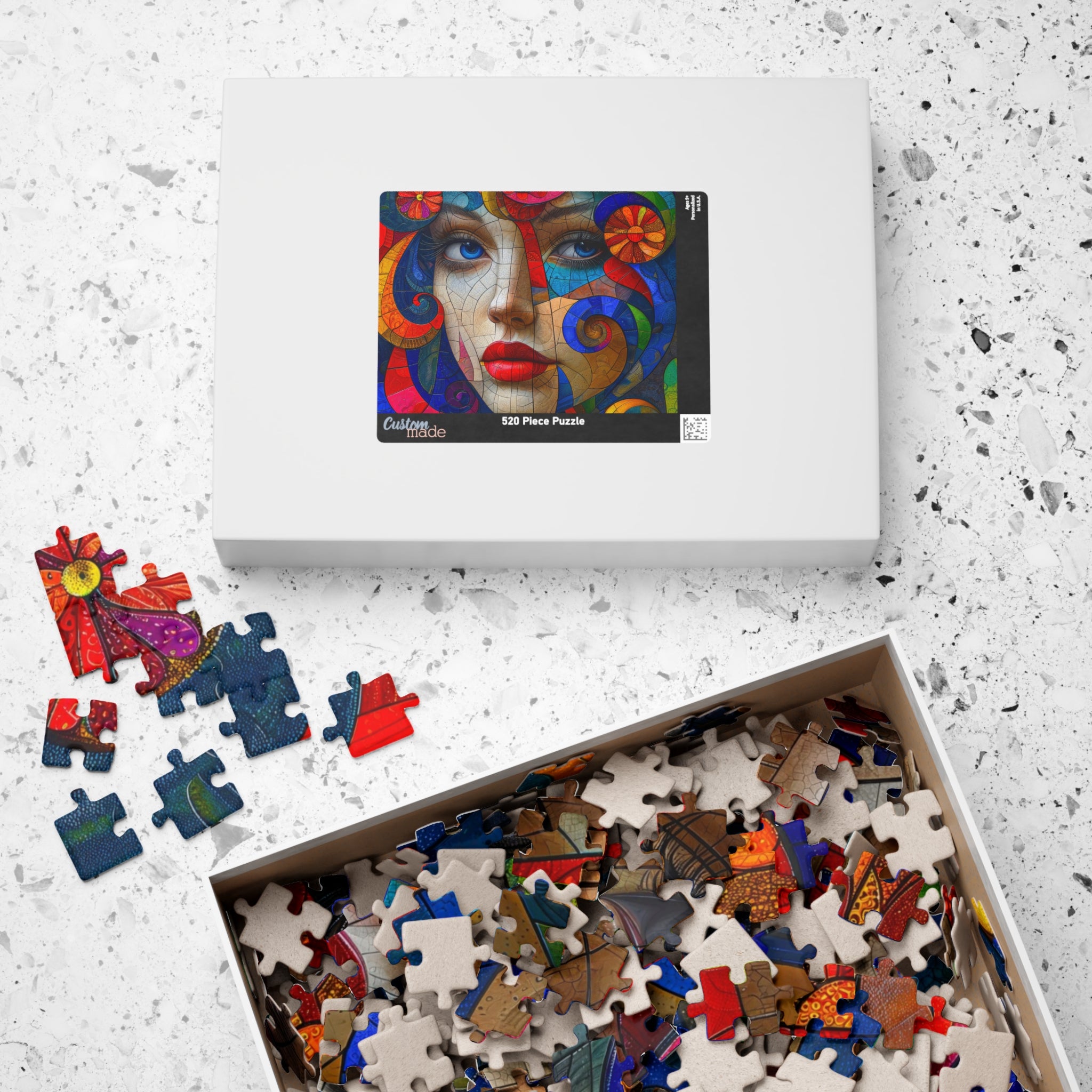 The packaging of the Blue Eyes Portrait 520 piece art puzzle by Printify, featuring the vibrant artwork and surrounding puzzle pieces, perfect for art enthusiasts.