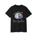 Artistic Puzzles 'Piece By Piece' Signature Brain Tee featuring a vibrant split brain design on a black t-shirt, made by Printify.