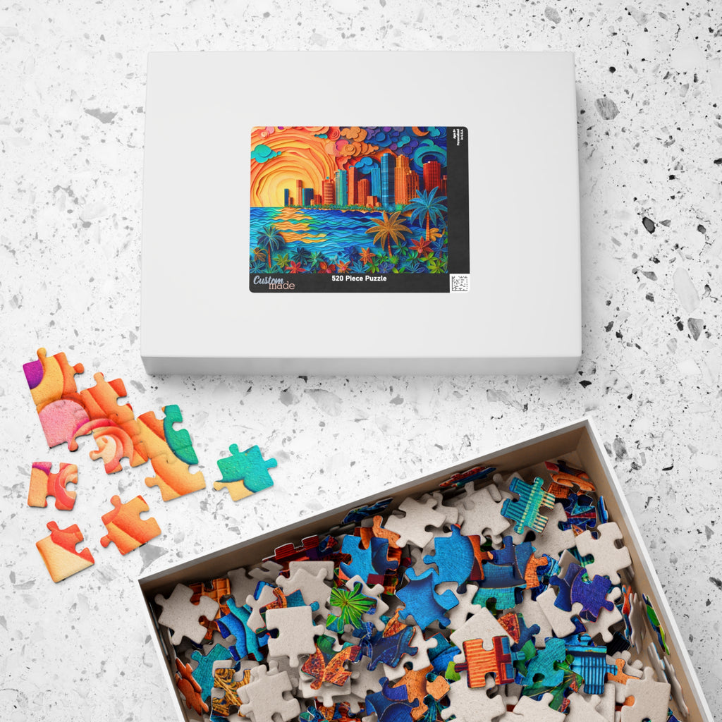 Beach City 520 Piece Art Puzzle by Printify in its box, opened to reveal vibrant puzzle pieces showcasing a coastal cityscape and the vibrant colors of a sunset.